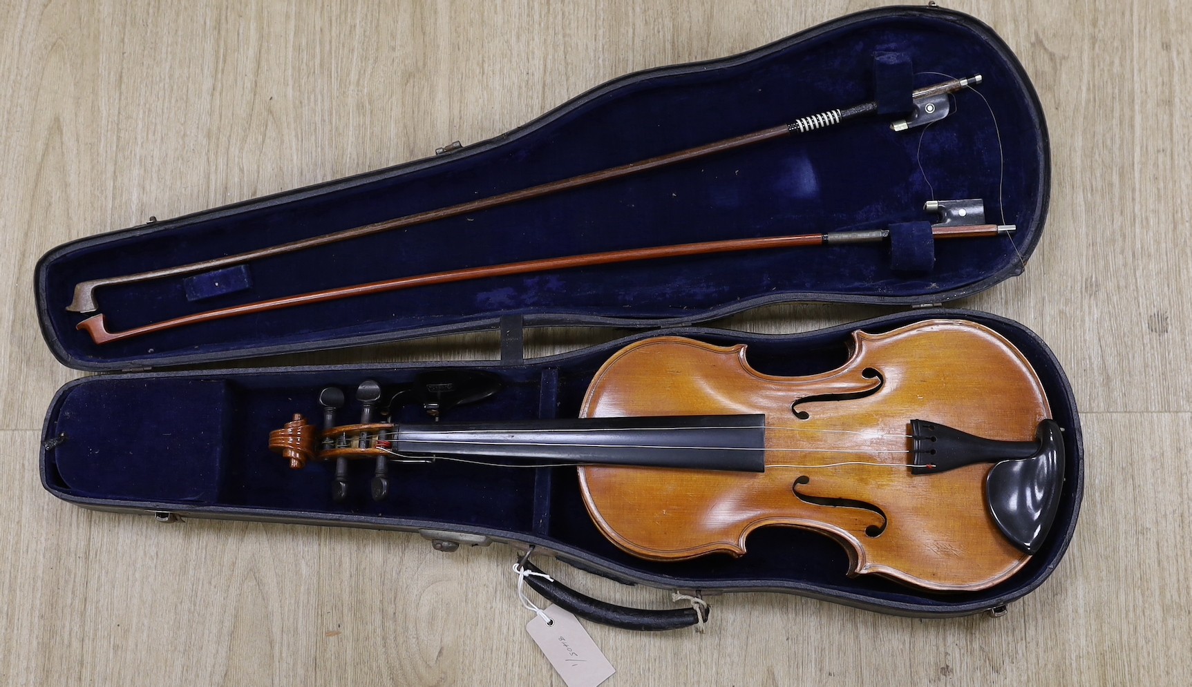A violin, labelled Luigi Salsedo, with two bows, in case